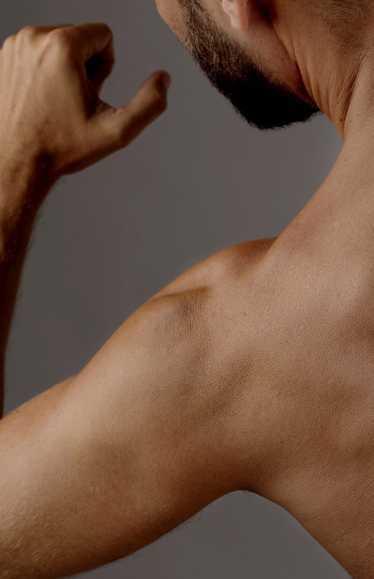 A doctor is giving an iv to a patient in a hospital bed.
