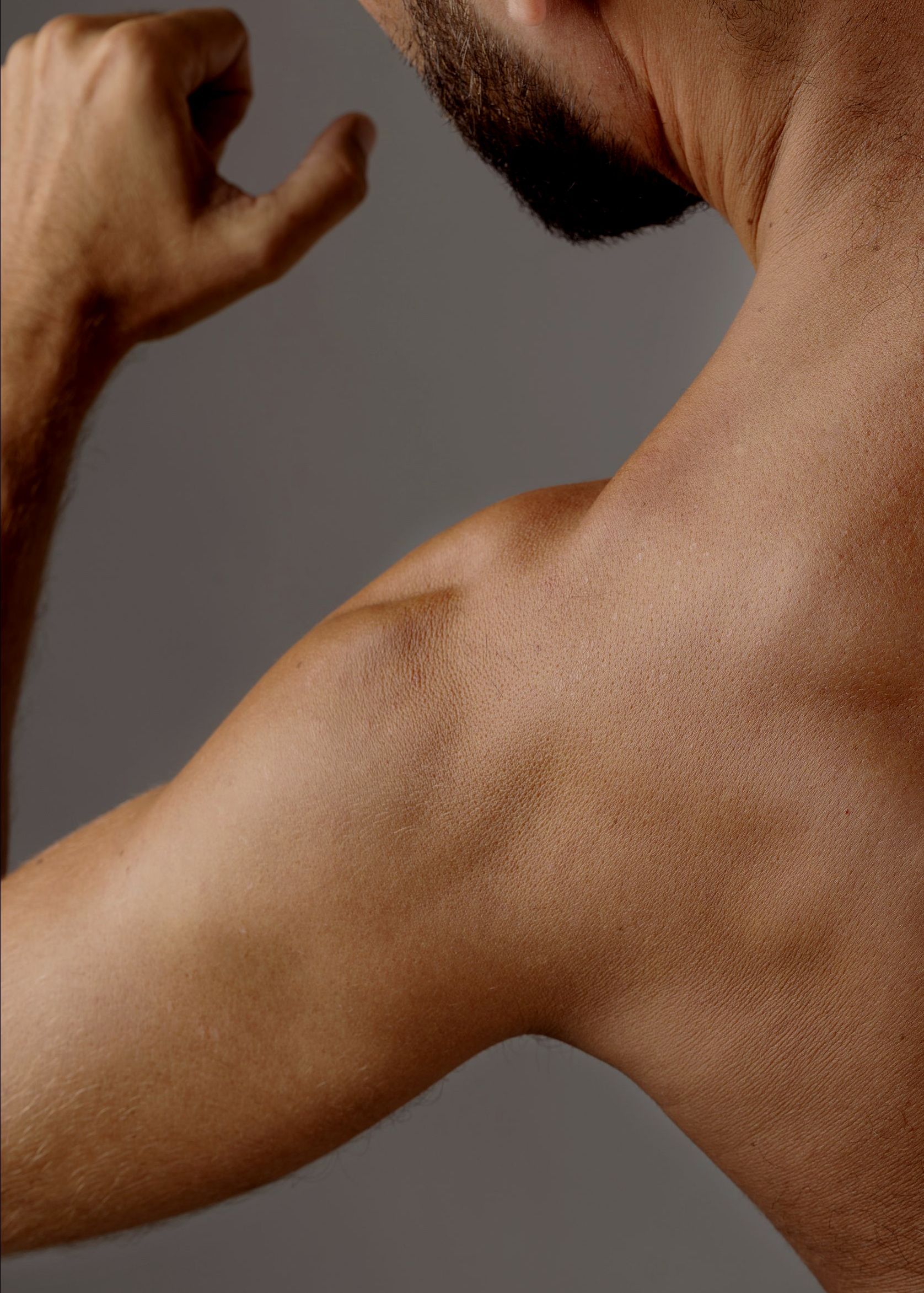 A doctor is giving an iv to a patient in a hospital bed.