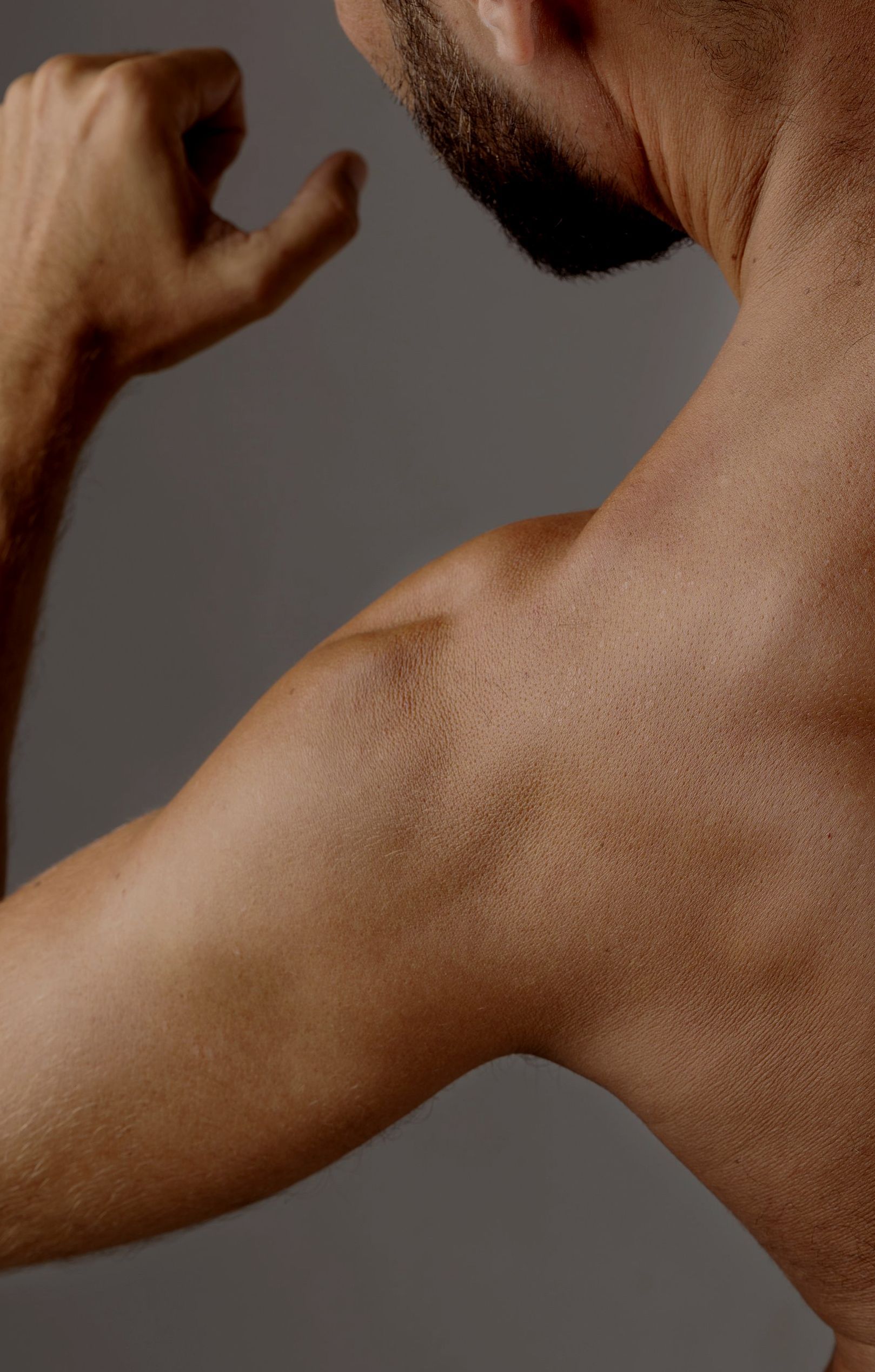 A doctor is giving an iv to a patient in a hospital bed.