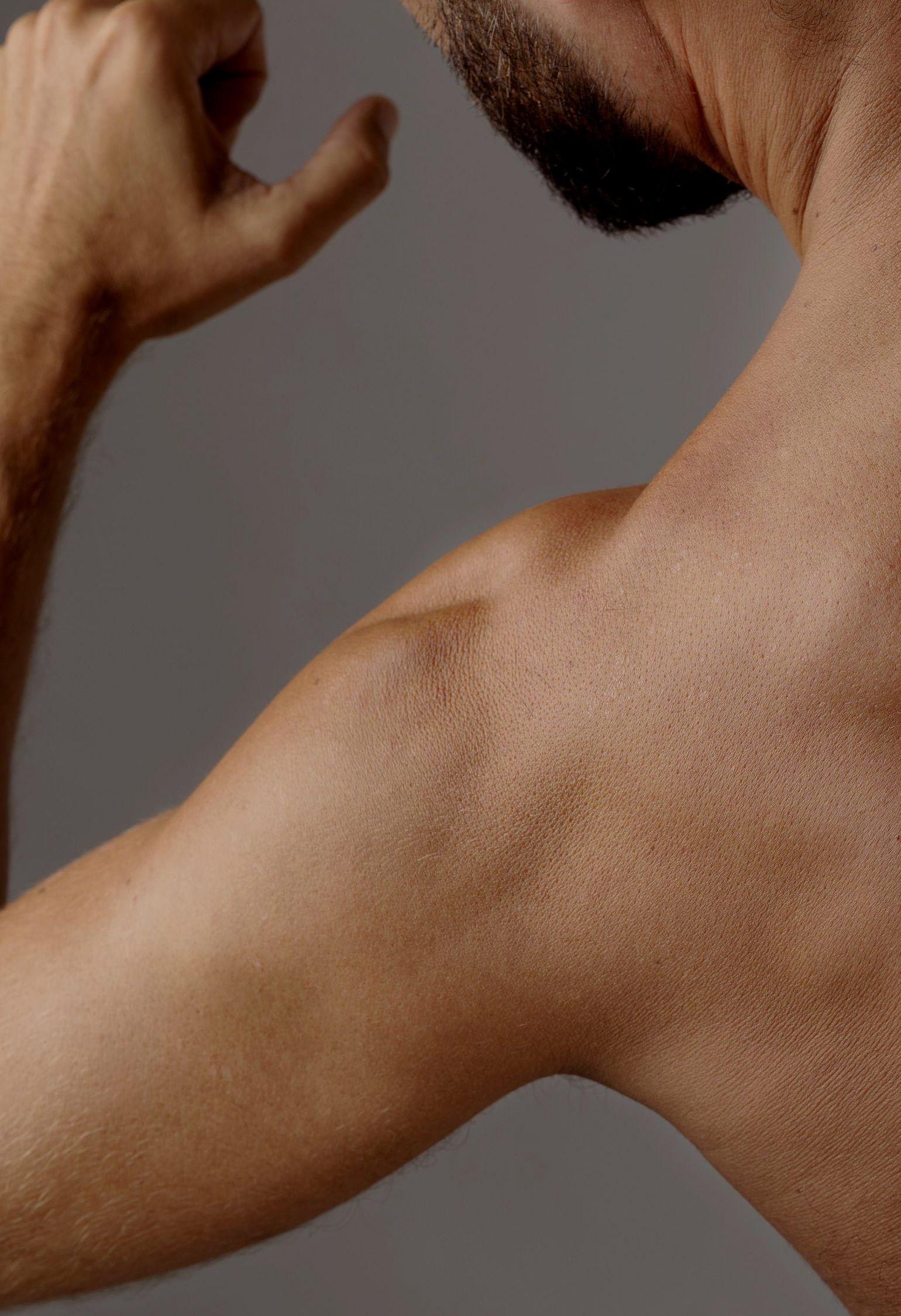 A doctor is giving an iv to a patient in a hospital bed.