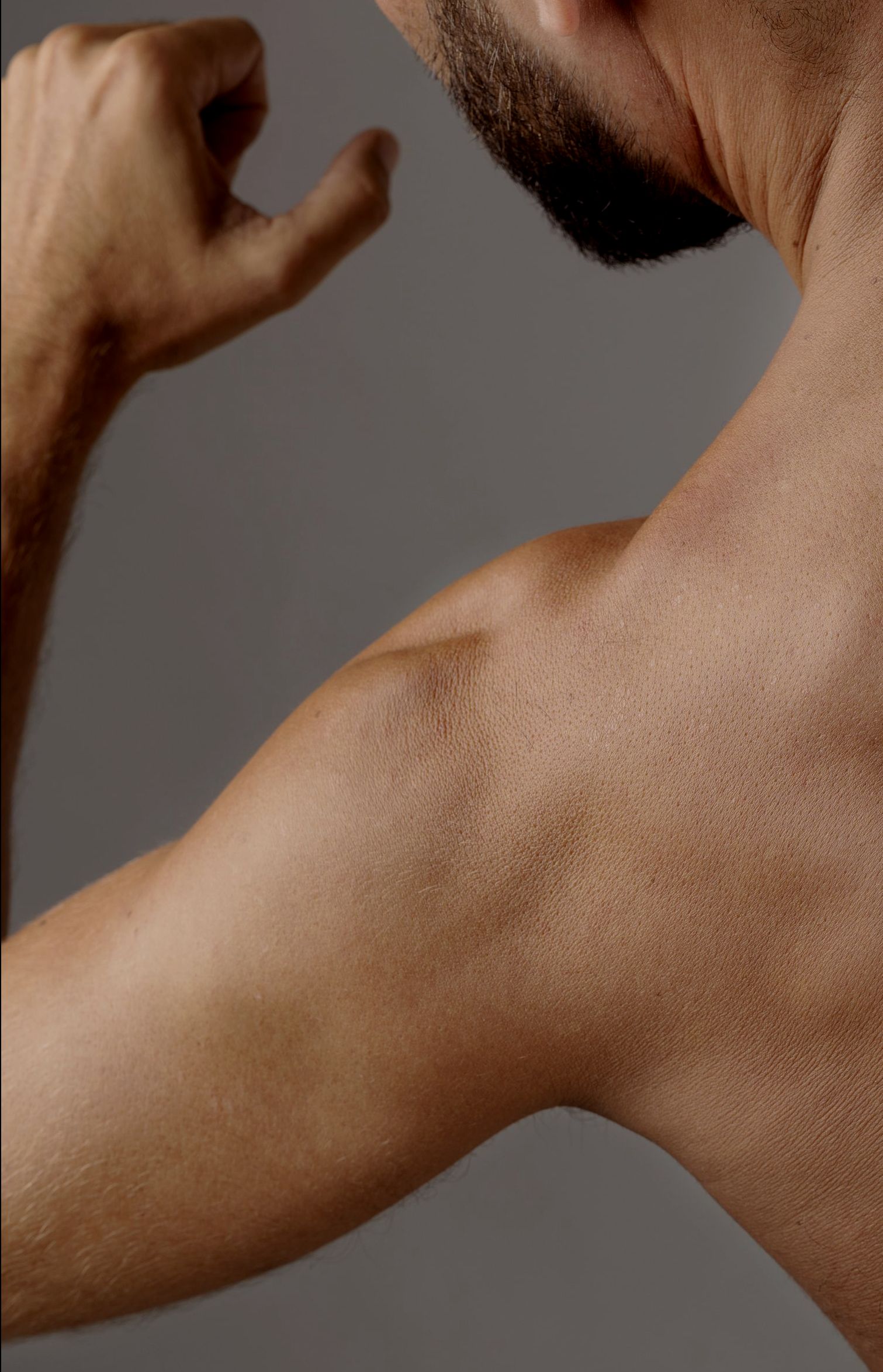 A doctor is giving an iv to a patient in a hospital bed.