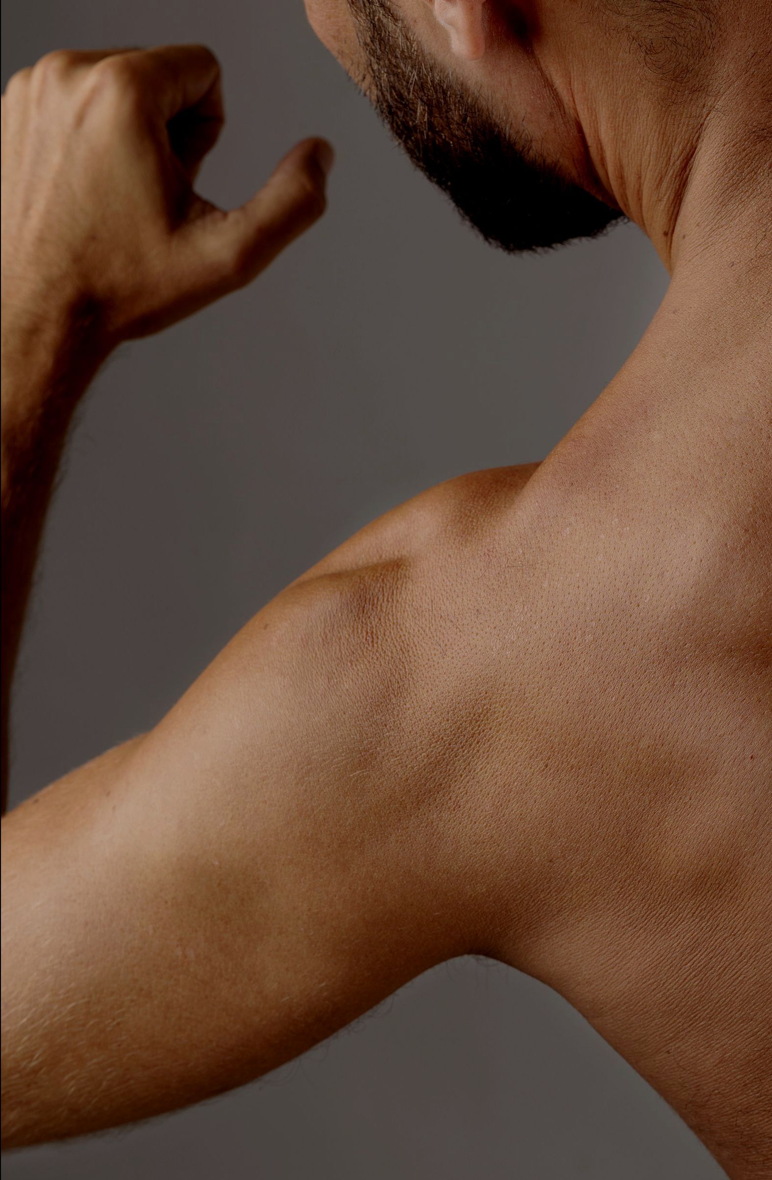 A doctor is giving an iv to a patient in a hospital bed.