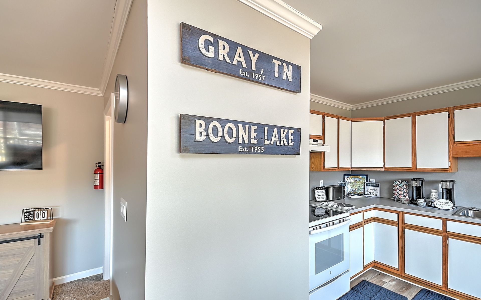 A kitchen with a sign on the wall that says boone lake.