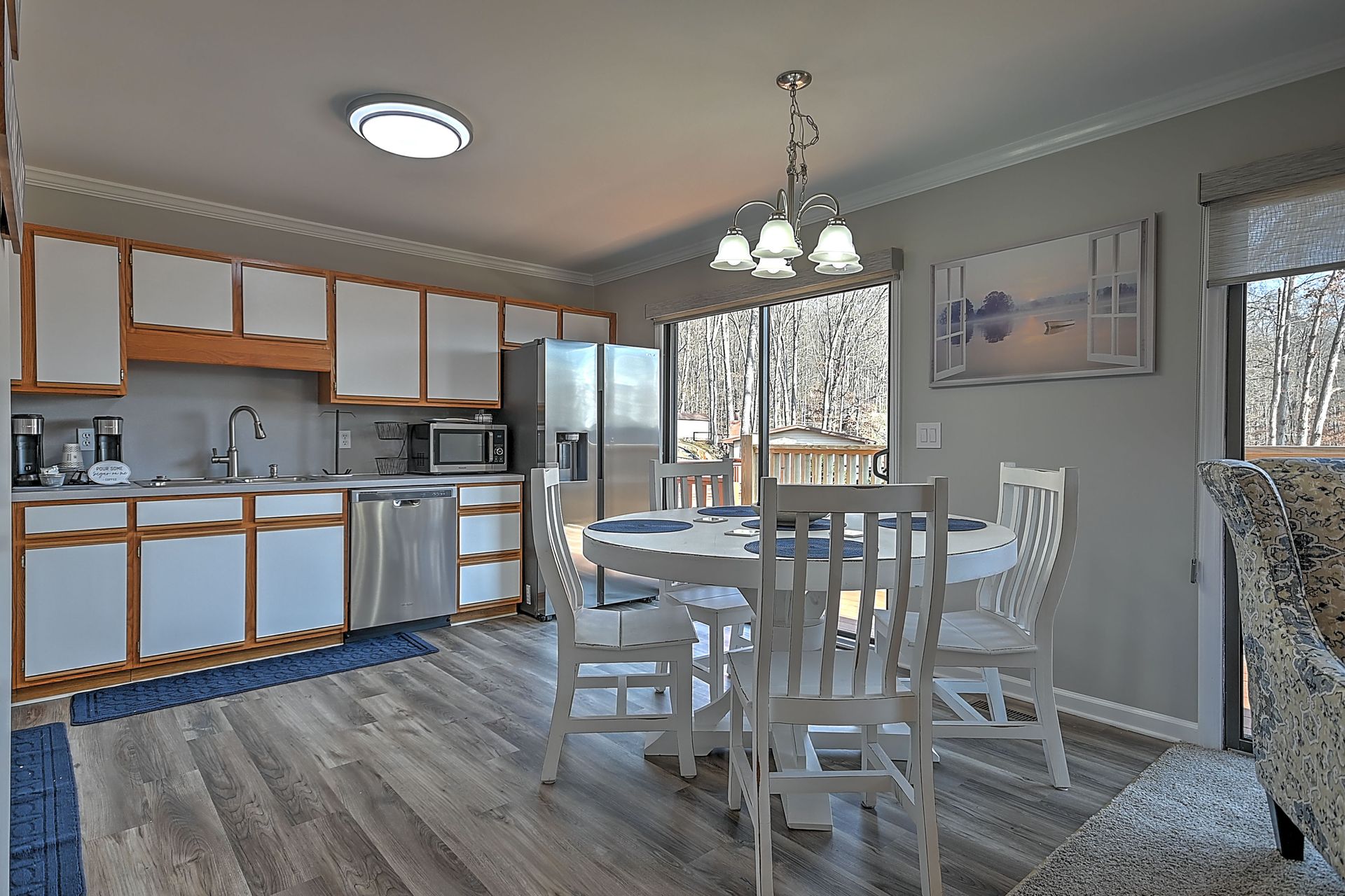 A kitchen with a table and chairs in it