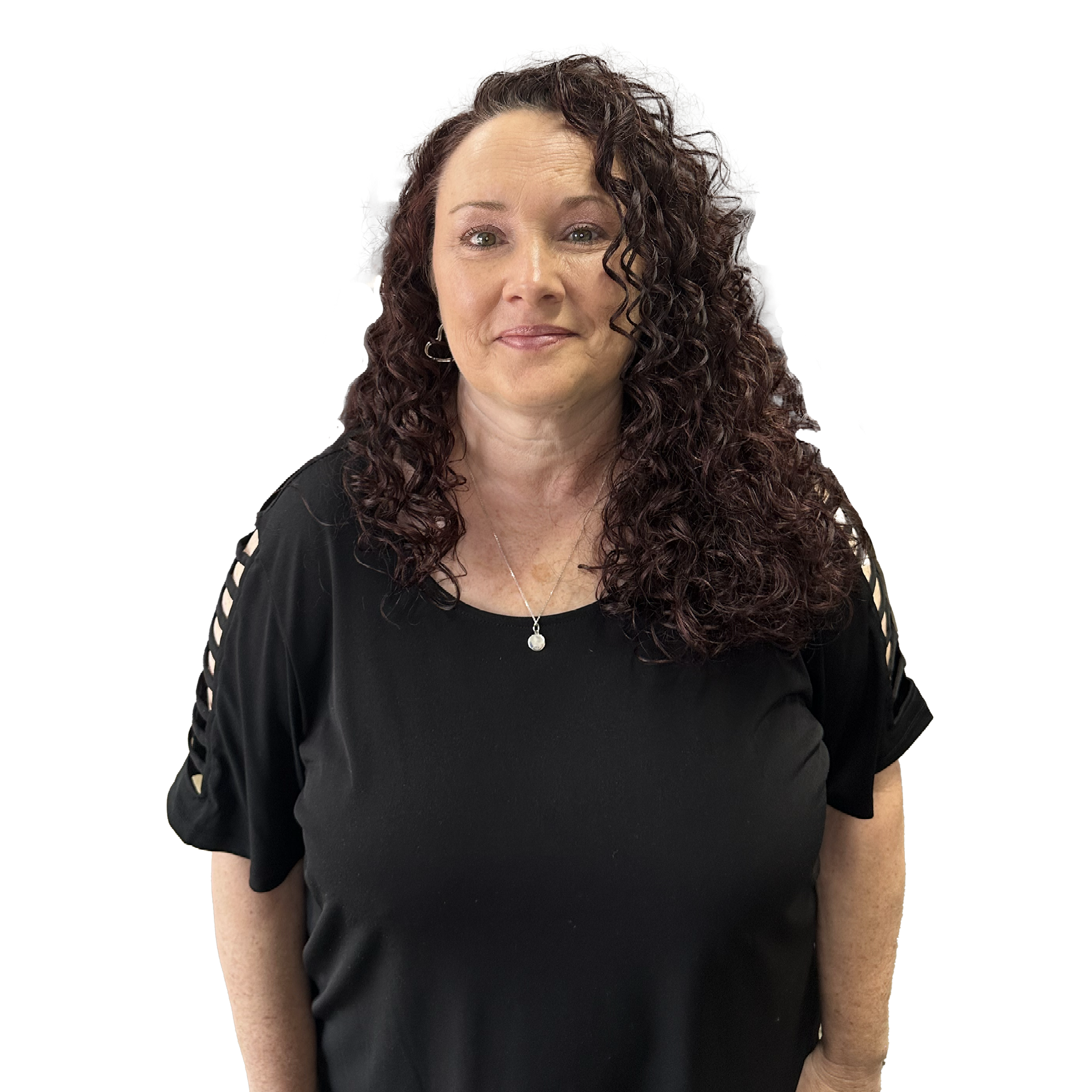 A woman with curly hair is wearing a black shirt and a necklace.