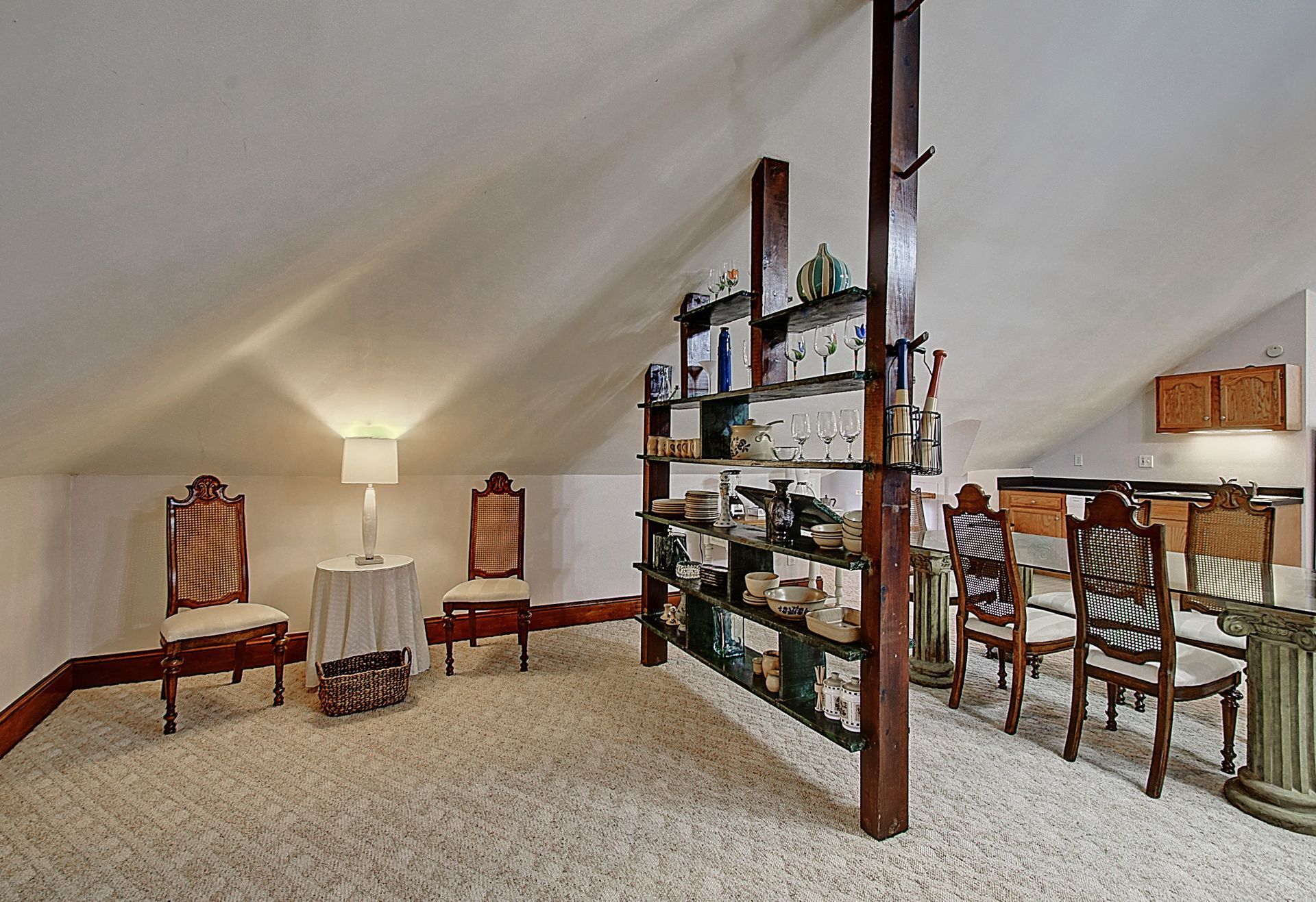 A room with a table and chairs in it