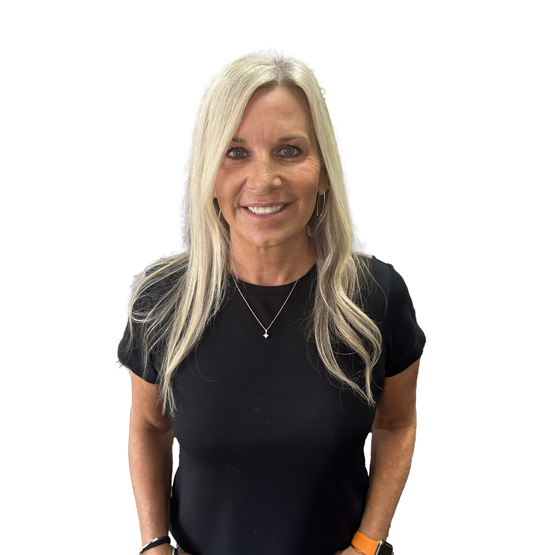 A woman wearing a black shirt and a necklace is smiling for the camera.