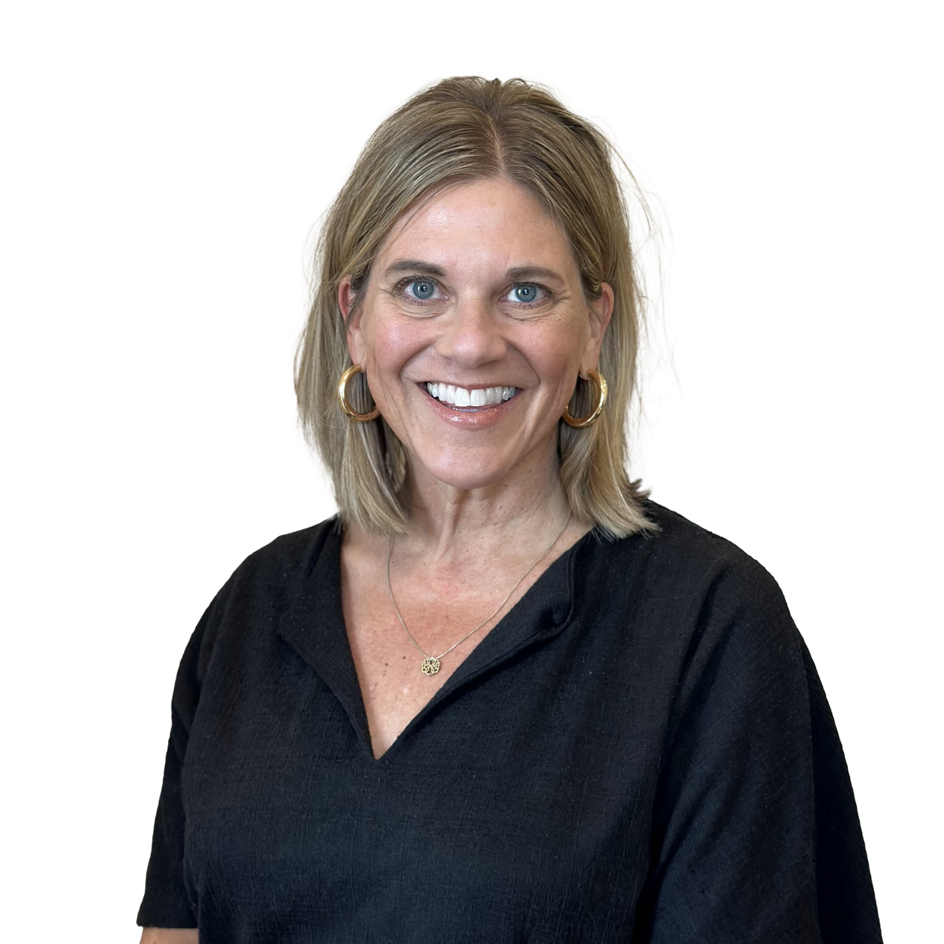 A woman wearing a black shirt and earrings is smiling for the camera.