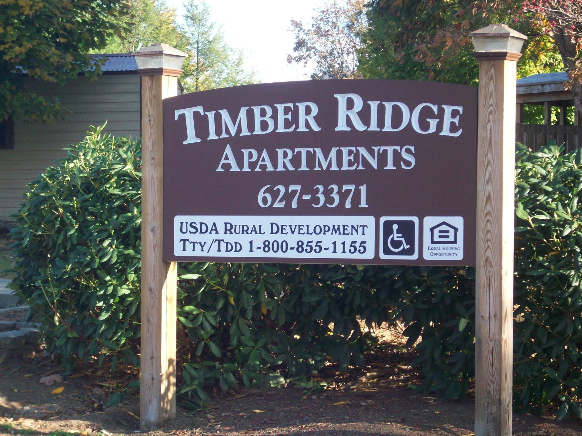 A sign that says timber ridge apartments on it