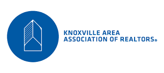 The knoxville area association of realtors logo is blue and white