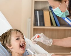 Paternity Testing — Doctor Checking The Mouth Of The Child in Gastonia, NC