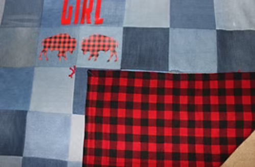 Patchwork quilt with blue denim and red buffalo plaid;