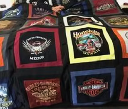 Harley-Davidson t-shirt quilt; various logos and patches stitched together in a patchwork design.