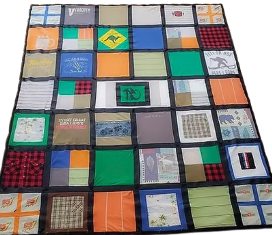 T-shirt quilt: various colored square t-shirts sewn together, bordered in black.