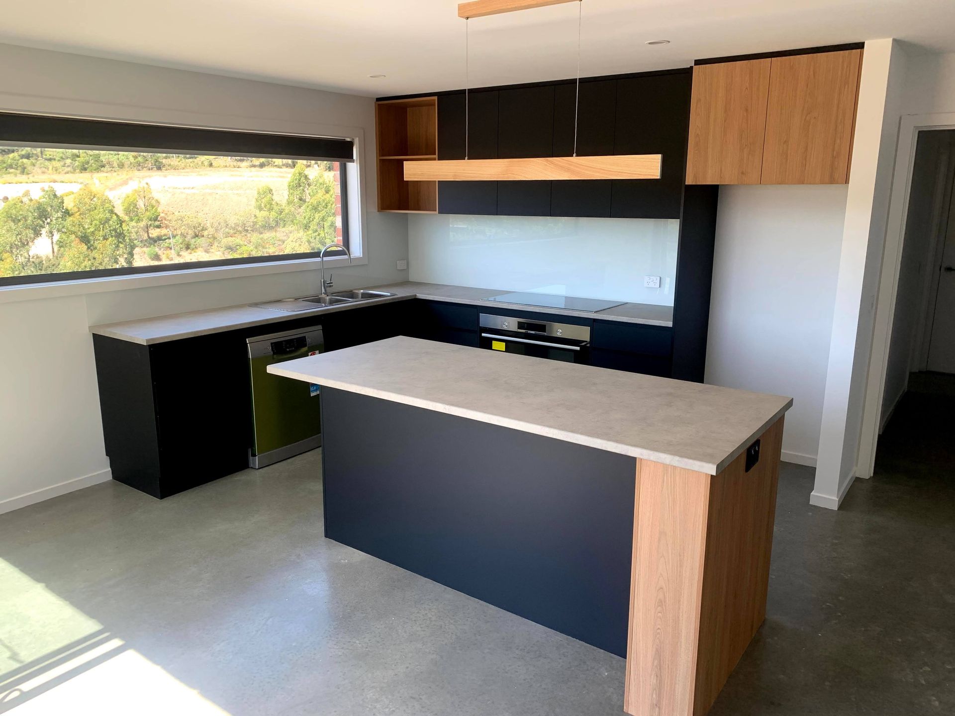 There is a large island in the middle of the kitchen.