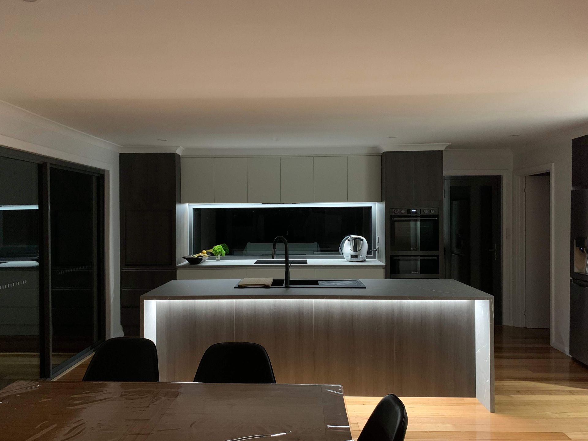 A kitchen with a large island in the middle of it