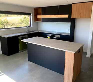 There is a large island in the middle of the kitchen.