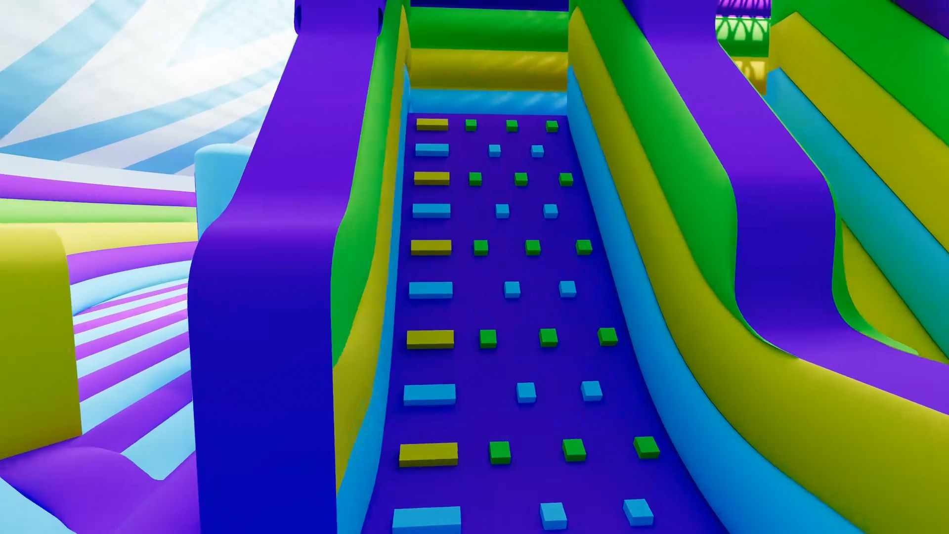 A colorful bouncy house with a slide and a climbing wall.