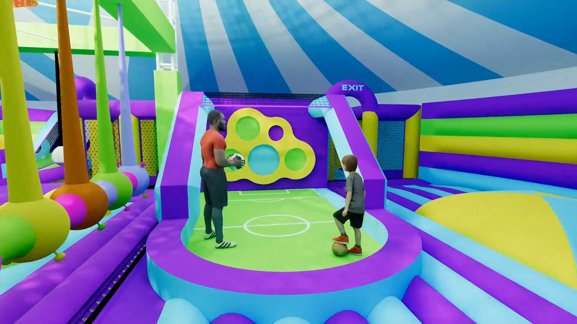 A man and a boy are playing soccer in an inflatable park.