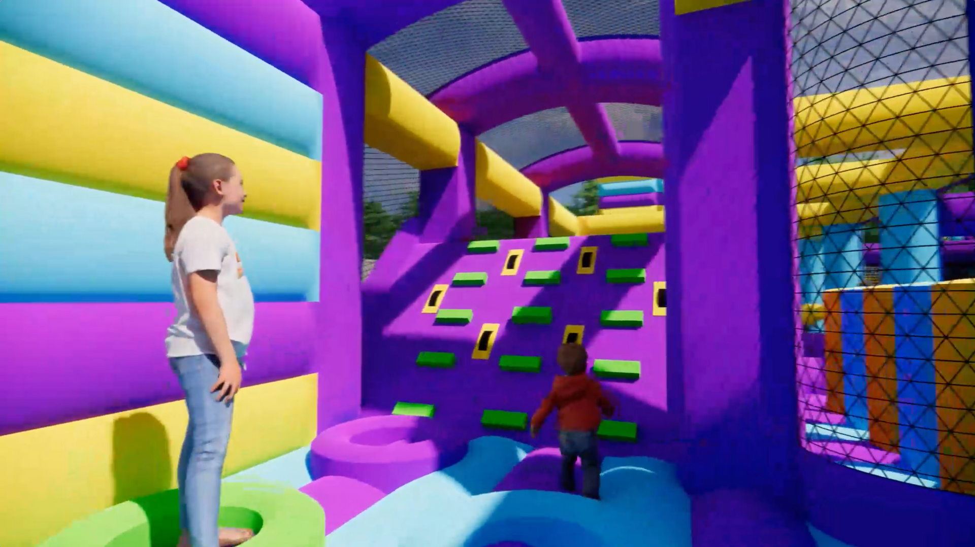A woman and a child are standing in a colorful bouncy house.