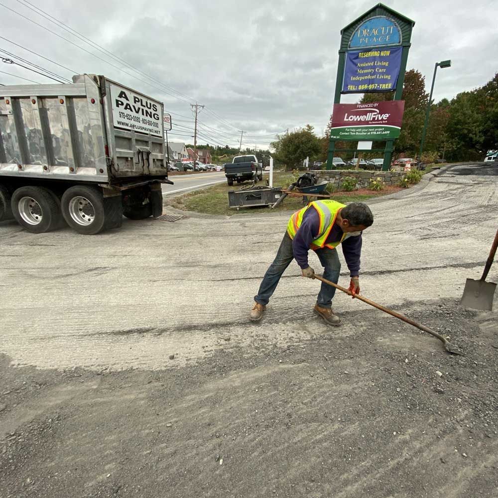 Man Shoveling Dirt — Andover, MA — A Plus Paving