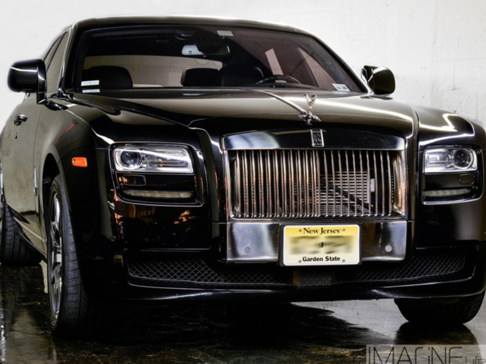 A lamp is sitting on a table in a living room.