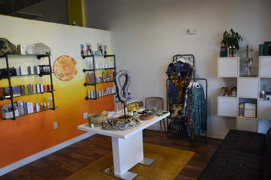 There is a table in the middle of the room with a lot of items on it.