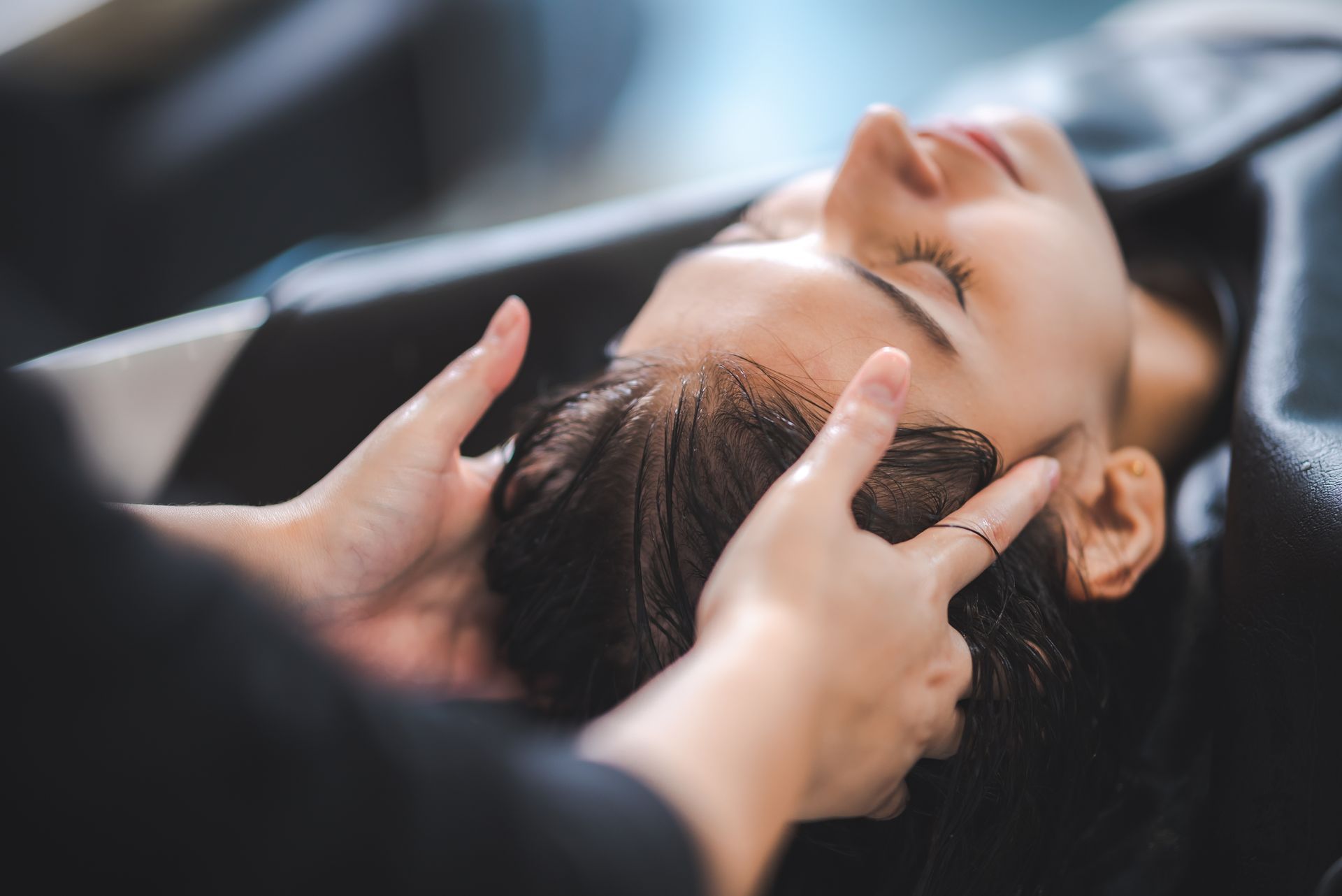 massaging woman's head