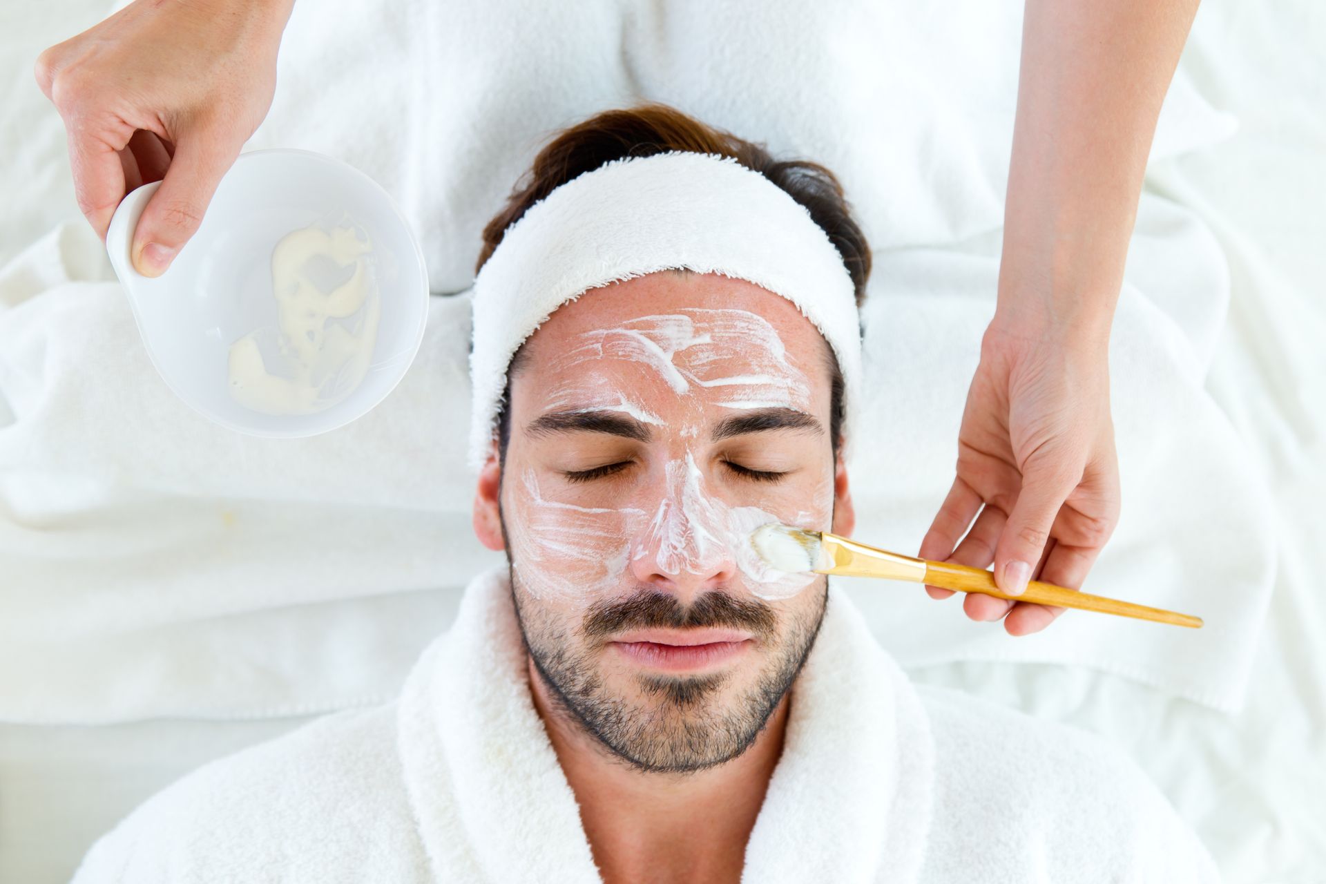 applying mask on man's face