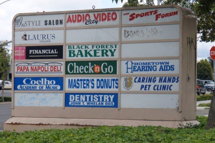 sign of shops in plaza