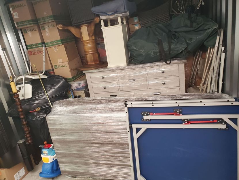 A warehouse filled with lots of boxes and tables.