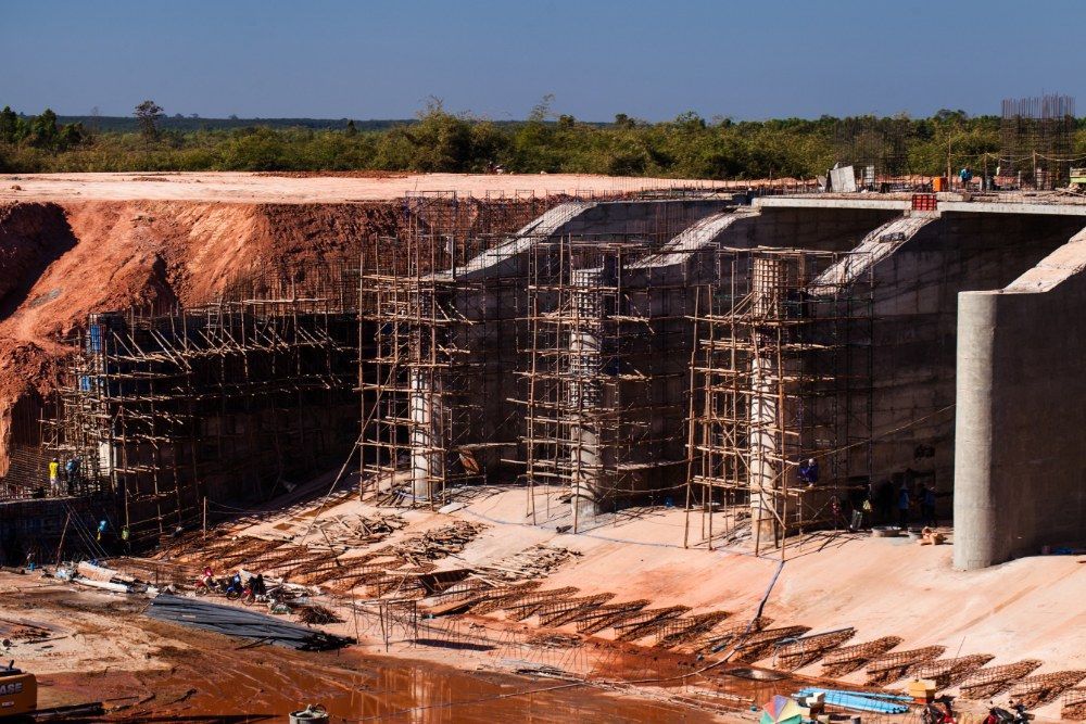 A Construction Site With Scaffolding on It — Jammach Earthmoving in Muswellbrook, NSW