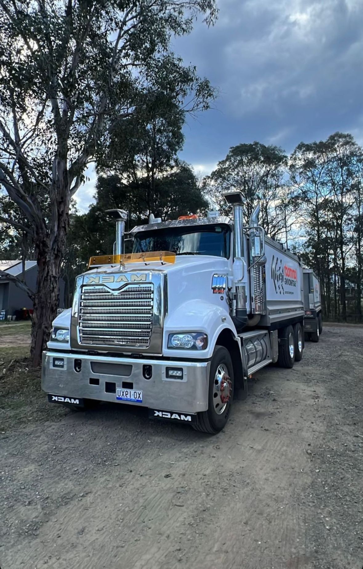 A Large Truck Parked in a Dirt Road — Jammach Earthmoving in Nulkaba, NSW