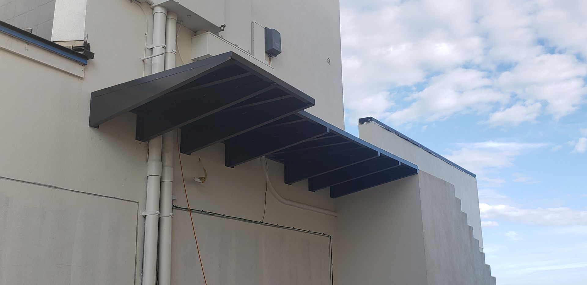 A building with a canopy on the side of it.