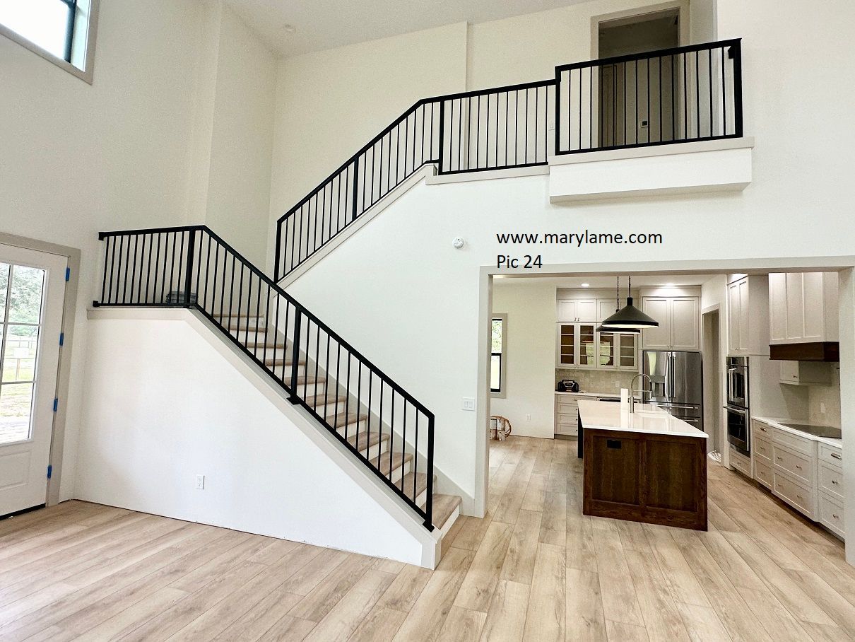 A staircase leading up to the second floor of a house
