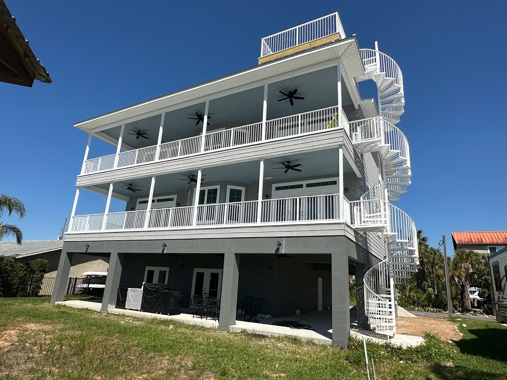 A large house with a spiral staircase on top of it.
