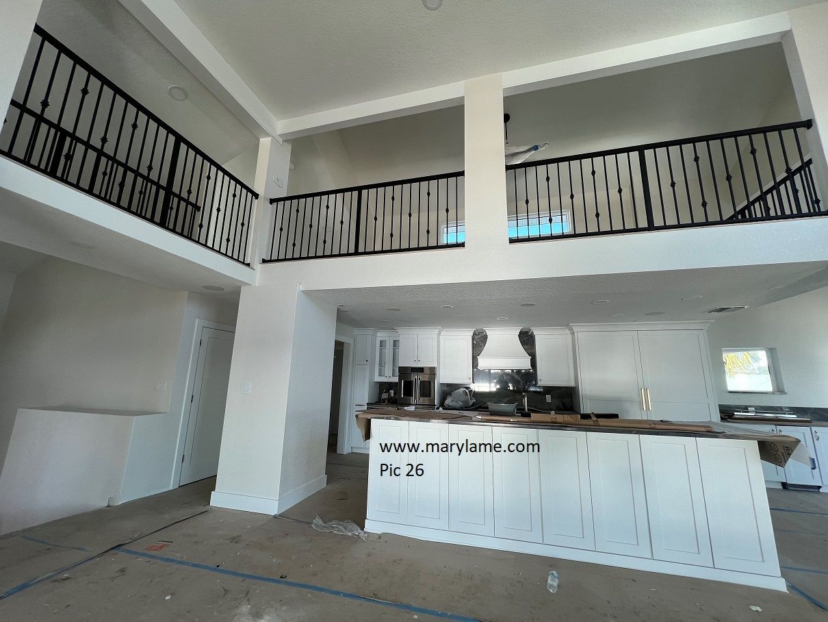 A kitchen with a balcony and a sign that says ' www.mywheel.com ' on it