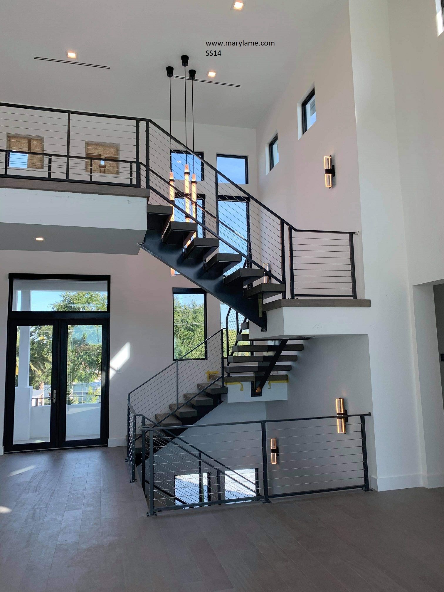 A wrought iron railing on a staircase in a house.