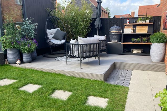 Outdoor living garden for a new build home with dining and seating zones