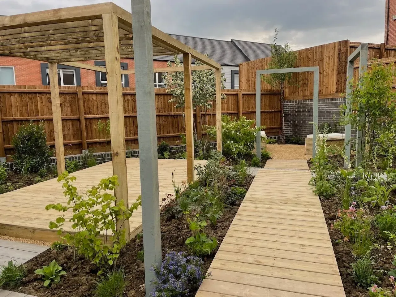 Low maintenance new build garden with planting led design and clean layout