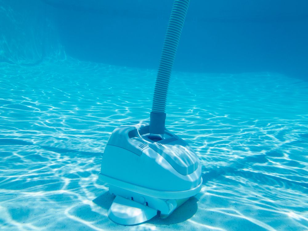 Underwater View of Vacuum Cleaning Bottom of Swimming Pool — Howard Springs, NT