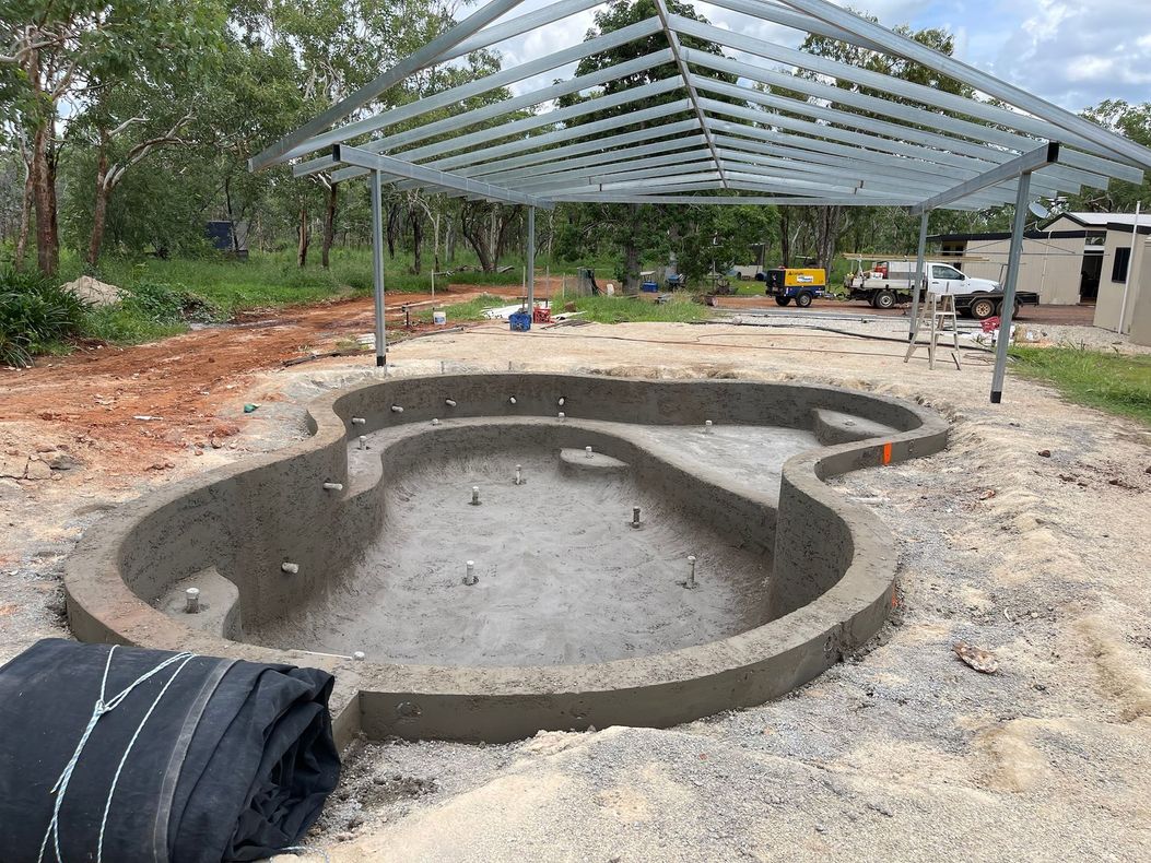 A Swimming Pool Is Being Built In The Dirt Under A Canopy — Pool Concepts in Howard Springs, NT