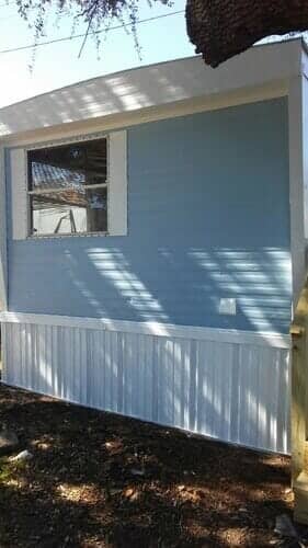 Blue house window — mobile home flooring in Morehead City, NC