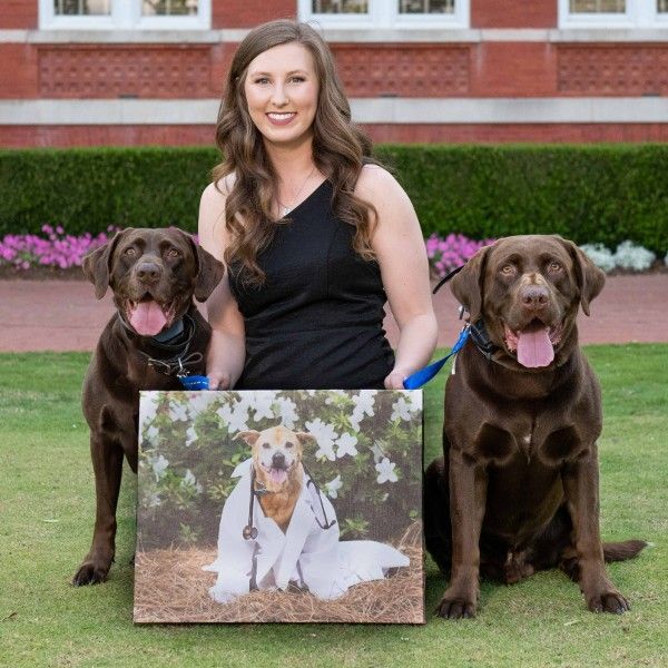 Dr. Caitlin Blackmon profile pic with her dogs.