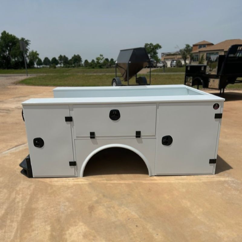 White rectangular utility bed with a large arched opening, outdoors on a concrete lot.