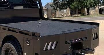 photo of black flatbed on truck that has been sprayed with bed liner
