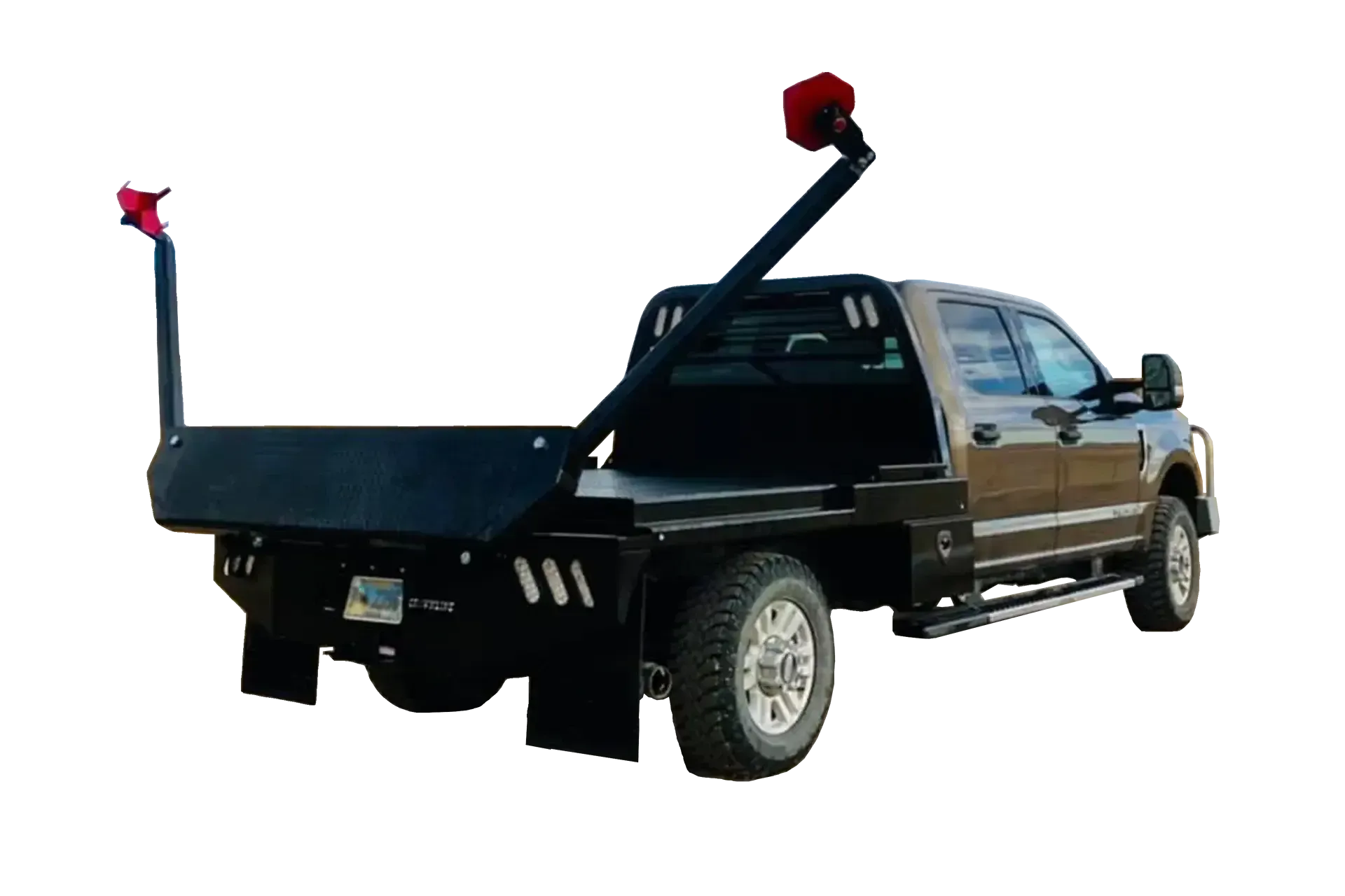 brown truck with black flatbed hay bed with arms to squeeze round bale