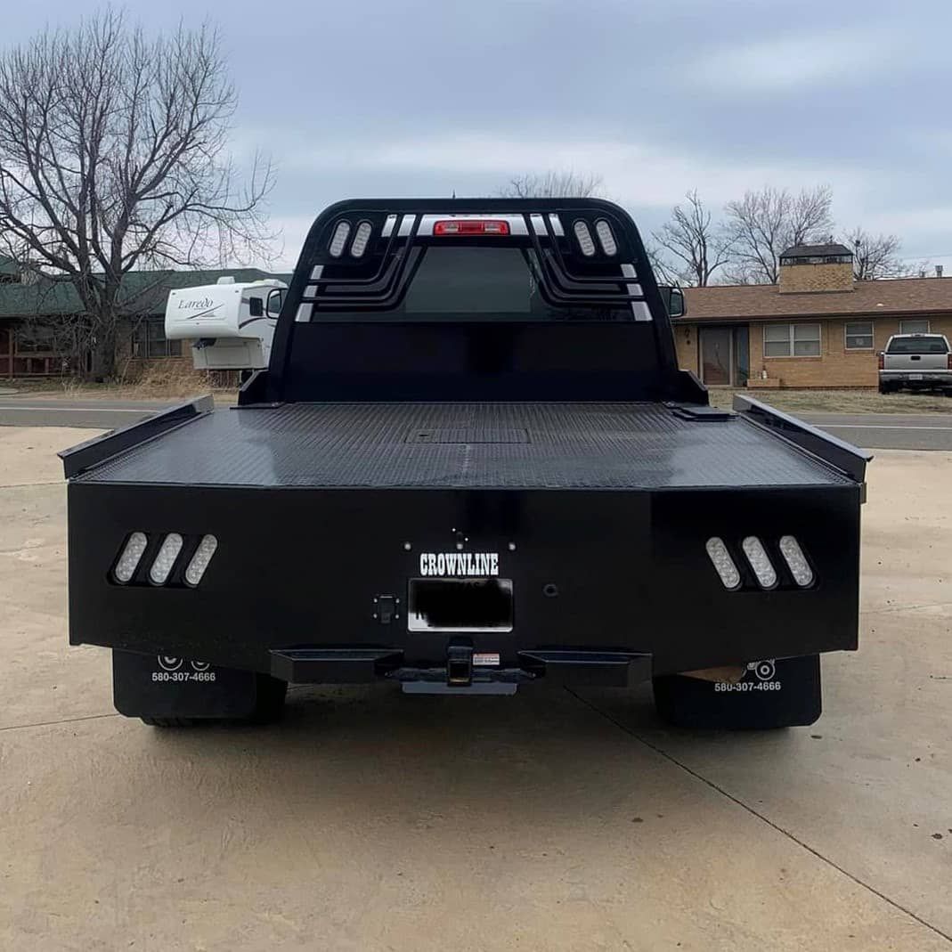 white dodge truck with black skirted flatbed rear view