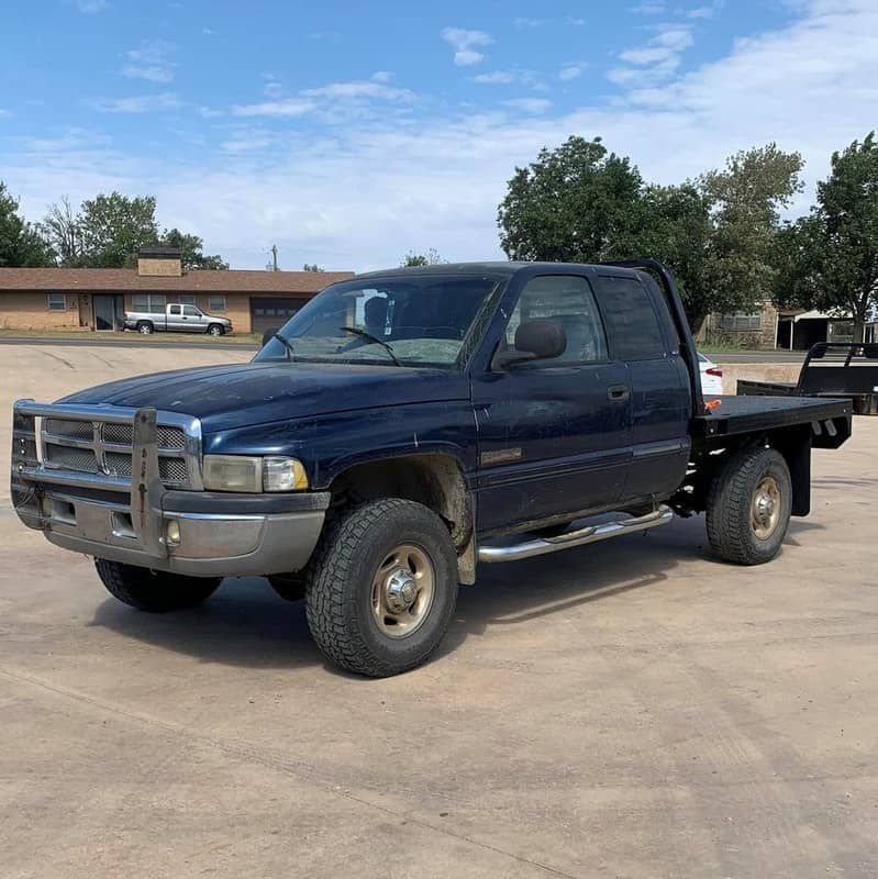 blue dodge truck with black flatbed