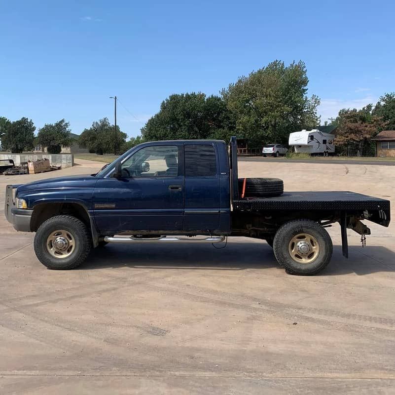 blue dodge truck with black flatbed